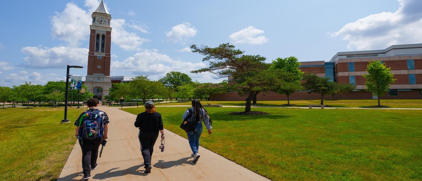 Students walking on campus with Elliott Tower 
